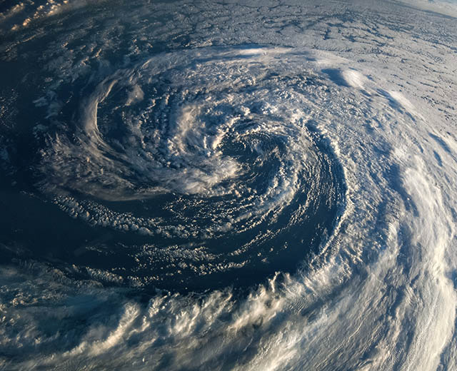 A hurricane swirling, as seen from above.