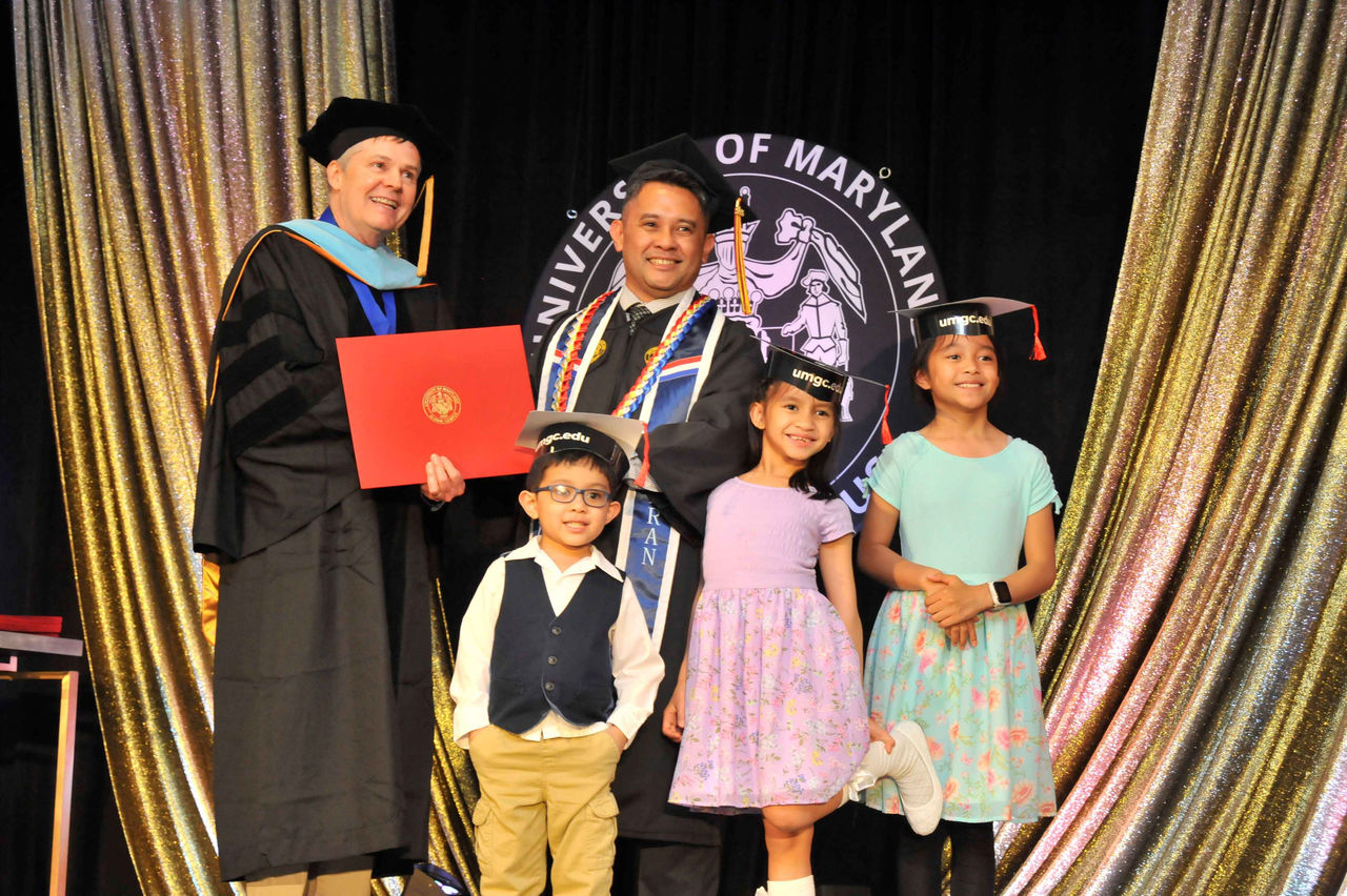 Many graduates had their children with them when they received their diplomas.